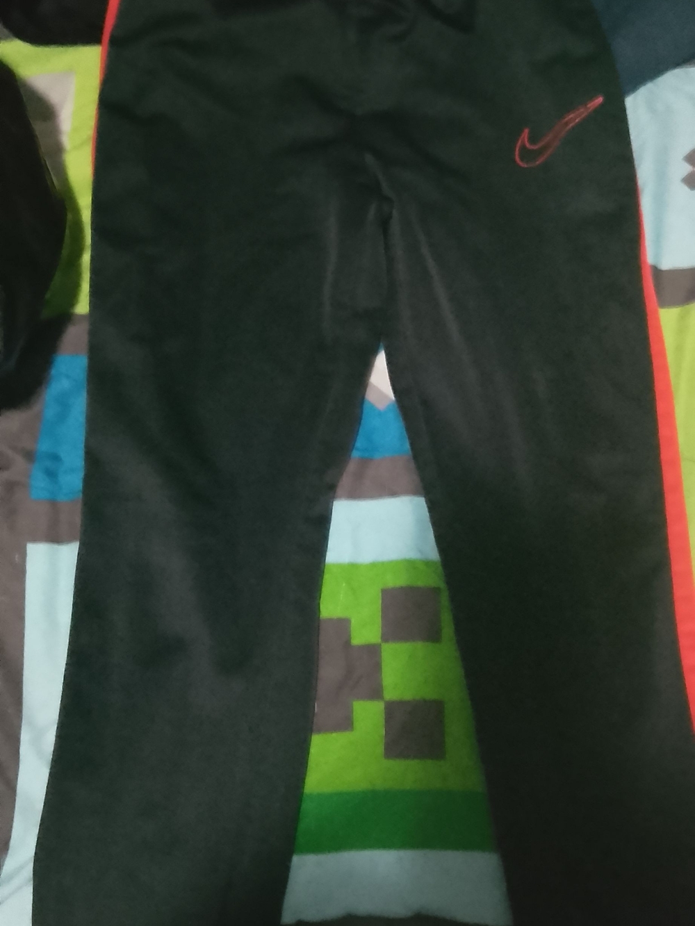Nike Kids Black Joggers with Red Swoosh and Side Stripe
